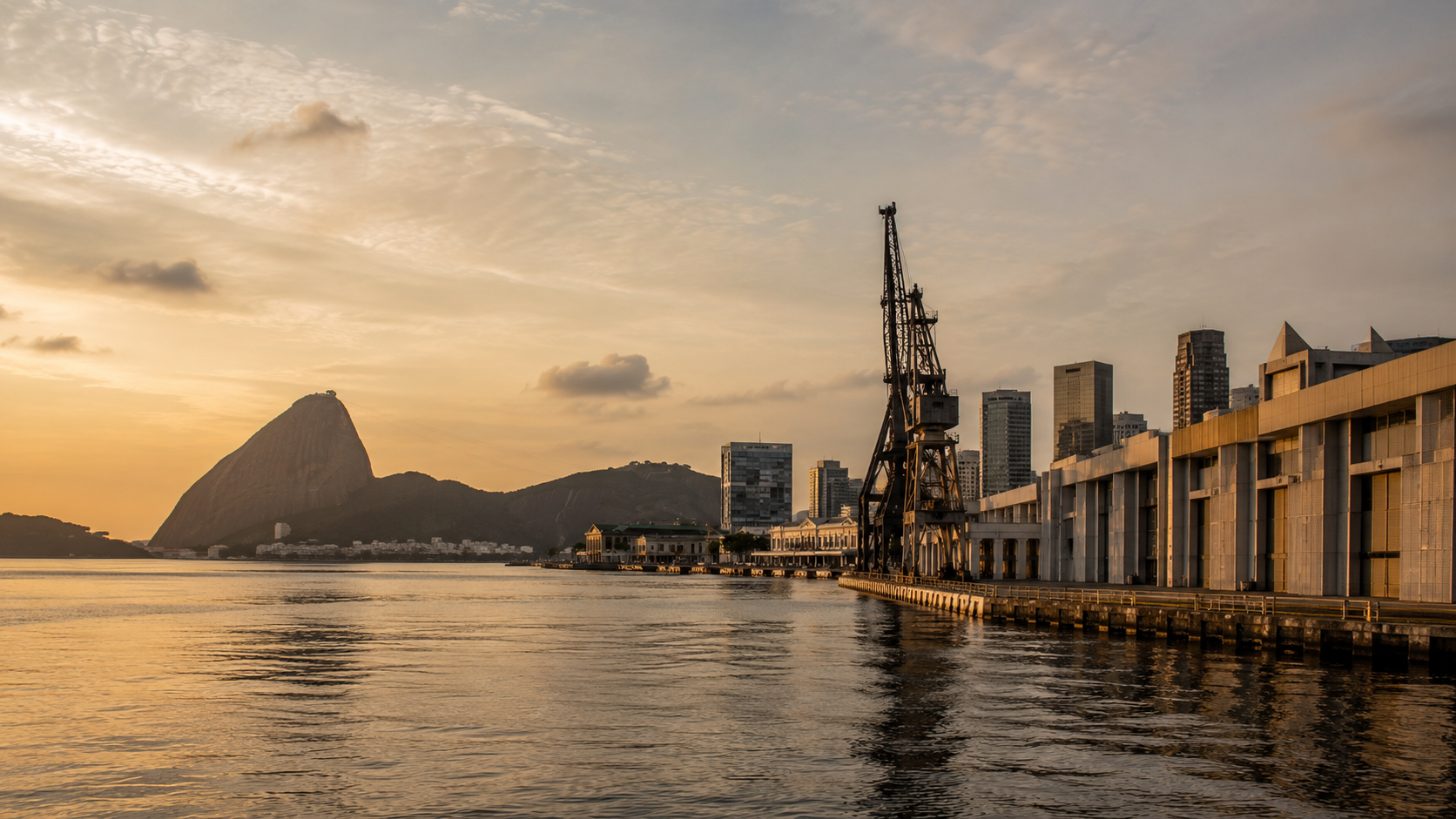 Rio de Janeiro industrial waterfront at sunset.